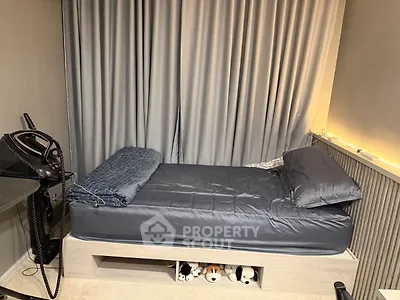 Cozy bedroom with single bed and soft lighting, perfect for relaxation.
