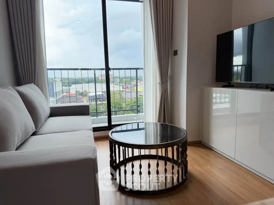 Modern living room with a stunning view, featuring a sleek sofa and stylish coffee table.