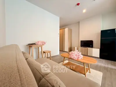 Modern living room with cozy sofa, stylish coffee table, and sleek TV unit in a contemporary apartment.