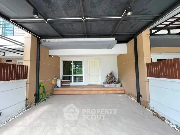 Spacious covered parking area with modern design and decorative elements.