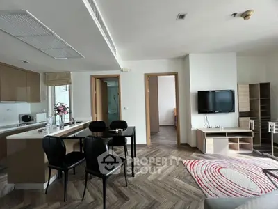 Modern open-plan living room with stylish kitchen and dining area