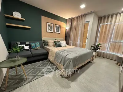 Modern bedroom with stylish decor and cozy seating area, perfect for relaxation and comfort.