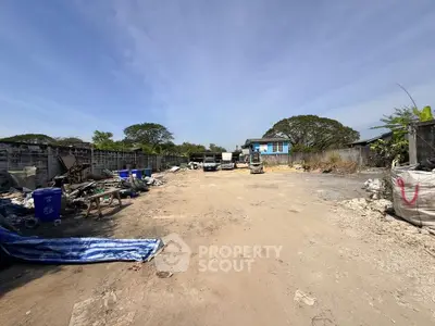 Spacious outdoor lot with potential for development, featuring open space and surrounding greenery.