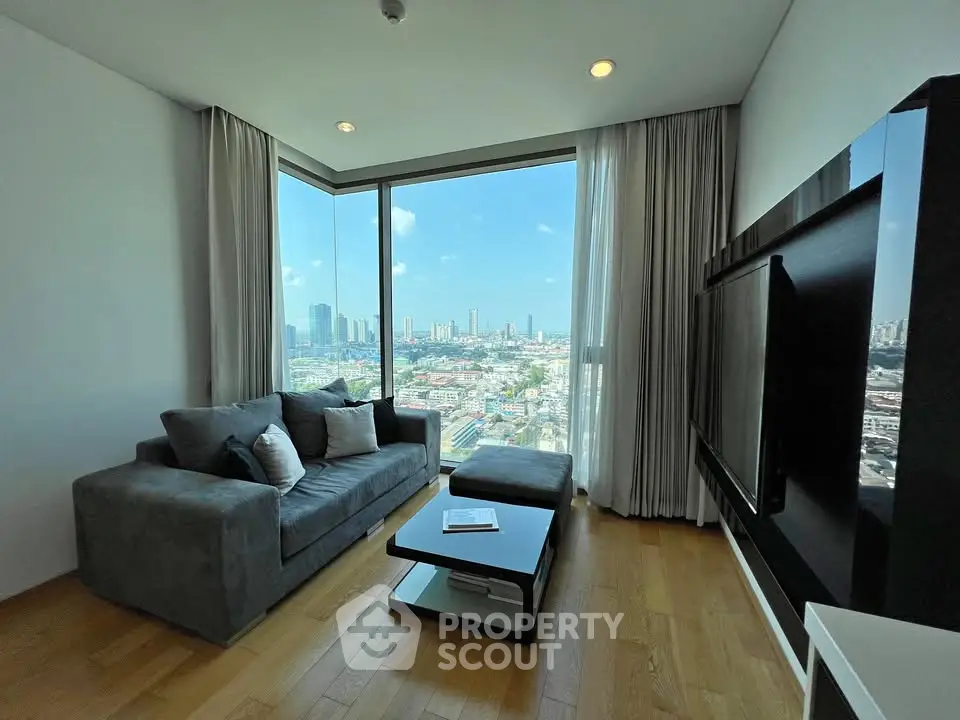 Modern living room with stunning city view and sleek furnishings