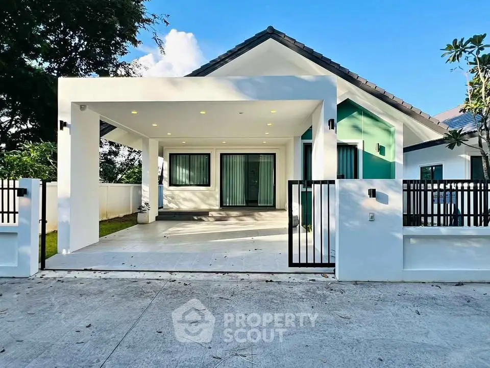 Modern single-story house with sleek design and spacious driveway