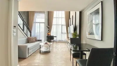 Luxurious modern living room with high ceilings and elegant decor