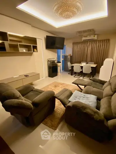 Luxurious living room with plush seating and elegant dining area, perfect for modern living.