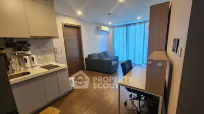 Modern apartment interior with cozy living room and compact kitchen