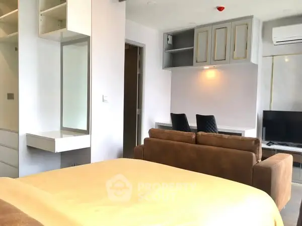 Modern studio apartment with stylish interior design and cozy living area.