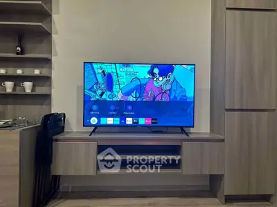 Modern living room with sleek TV setup and stylish wooden cabinetry