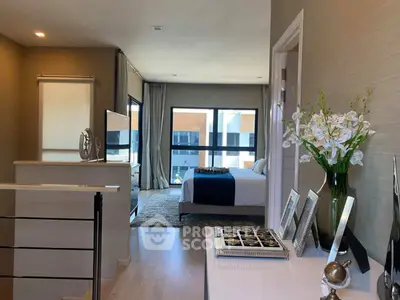 Luxurious bedroom with modern decor and large windows offering natural light.