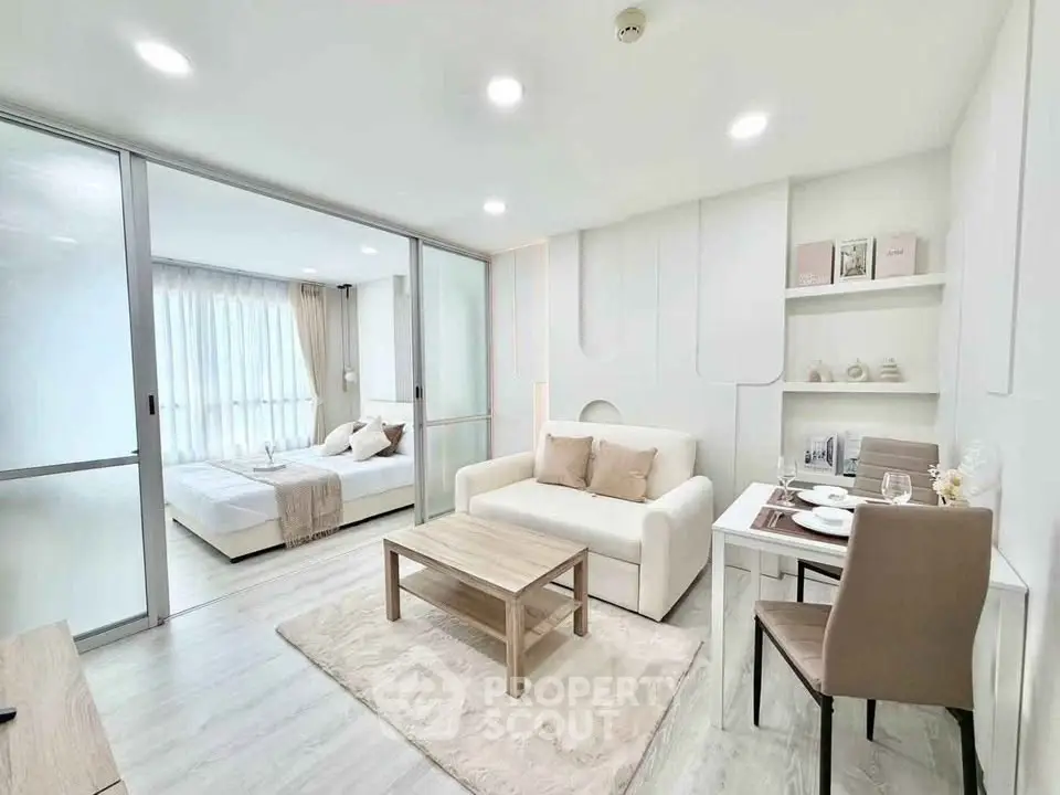 Modern open-plan living room with cozy dining area and stylish decor