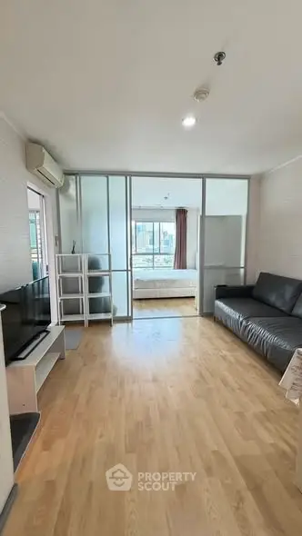 Spacious living room with modern decor and natural light