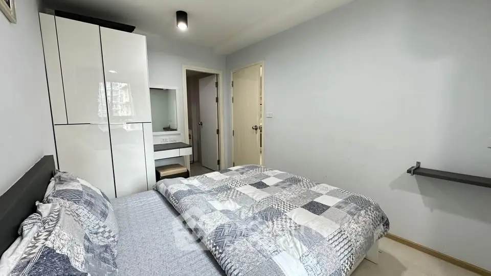 Cozy bedroom with modern decor and ample storage space