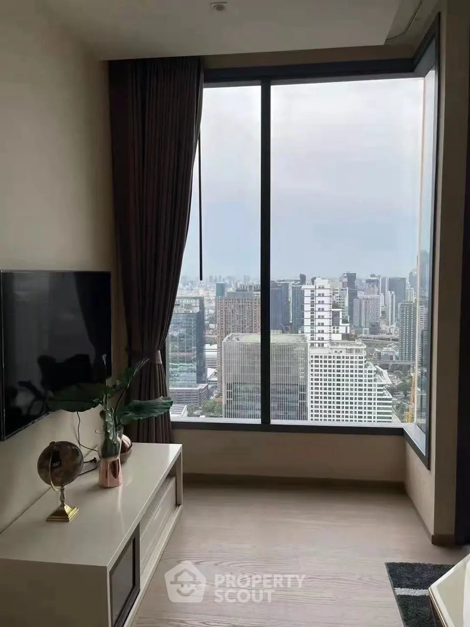 Modern living room with stunning city view through large window