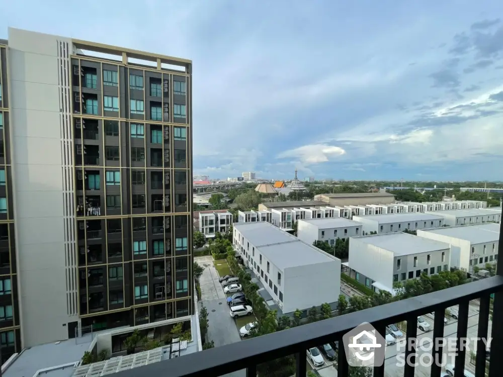 Modern apartment building with scenic city view from balcony