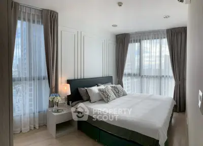 Luxurious bedroom with panoramic city views and elegant decor