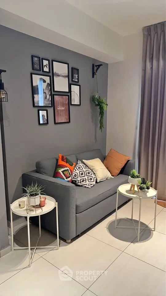 Chic living room with modern decor and cozy seating area, perfect for relaxation.