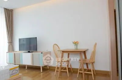 Modern living room with sleek TV stand and cozy dining area