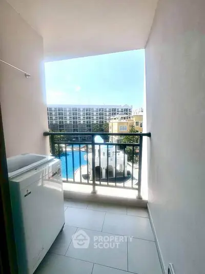Charming balcony with pool view, perfect for relaxation and enjoying the outdoors.