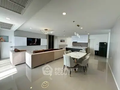 Spacious modern living room with open kitchen and elegant dining area
