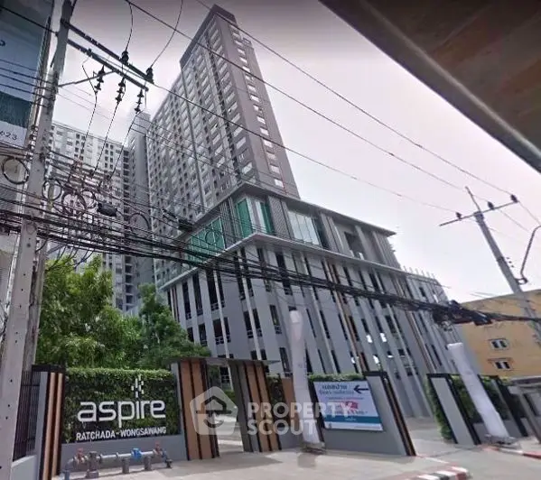 Modern high-rise condominium building with sleek design and urban appeal.