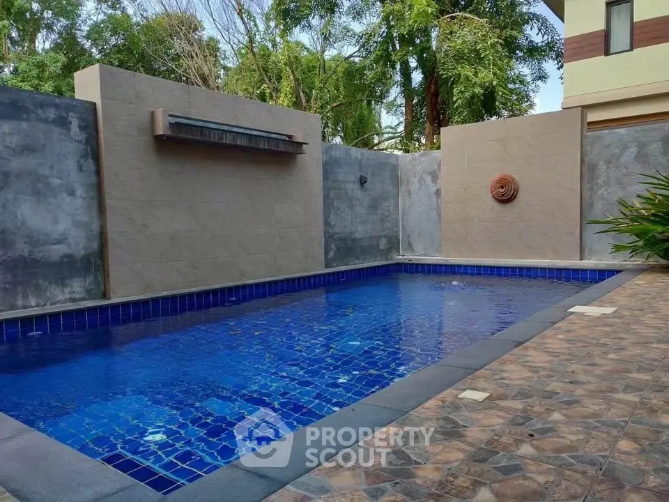 Luxurious private pool with elegant tile design and serene surroundings, perfect for relaxation and entertainment.