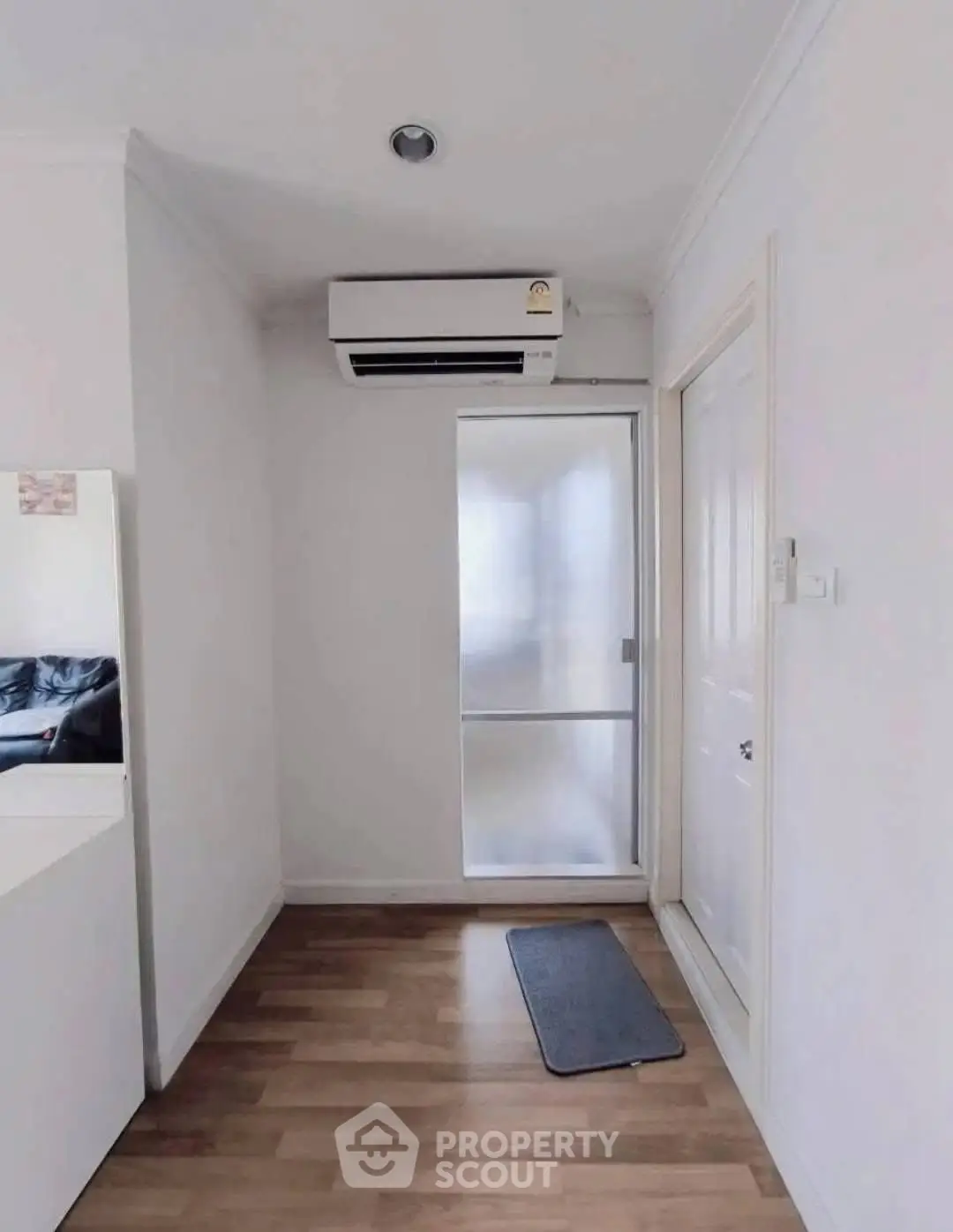 Modern minimalist hallway with air conditioning and wooden flooring