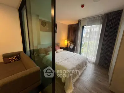 Modern bedroom with cozy decor and large window for natural light