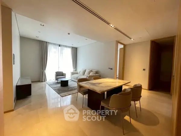 Spacious modern living room with elegant dining area and natural light