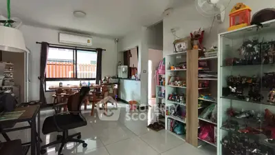 Spacious living room with modern decor and ample natural light