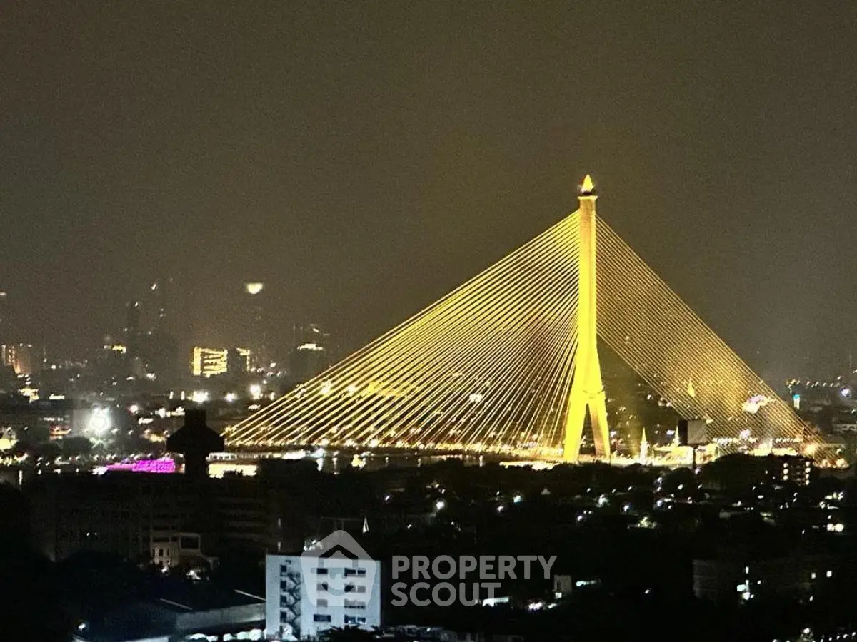 Stunning night view of illuminated cable-stayed bridge over cityscape, perfect for urban living enthusiasts.