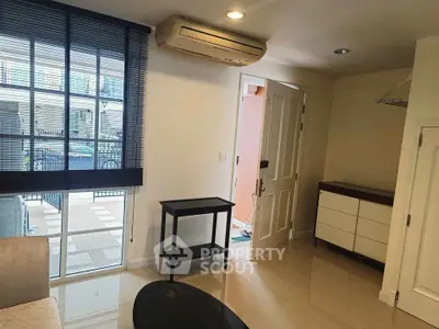 Modern living room with sleek air conditioning and stylish furniture