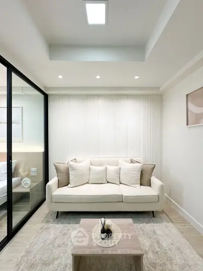 Modern living room with elegant decor and cozy seating area