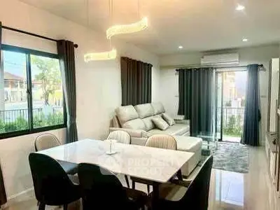 Modern living room with elegant dining area and cozy sofa, featuring large windows and stylish lighting.