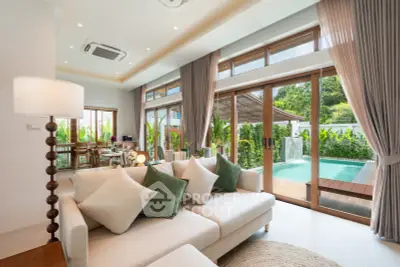 Luxurious living room with pool view and elegant decor