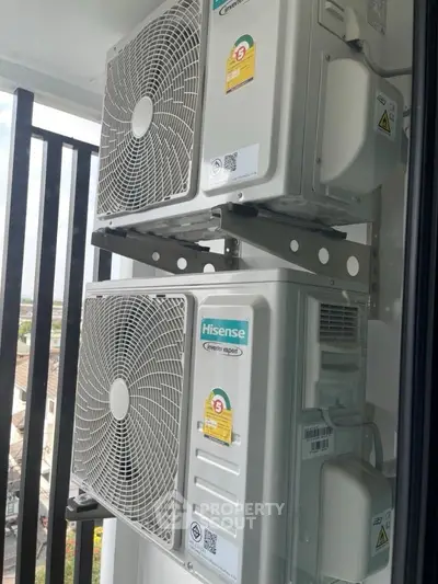 Modern balcony with dual Hisense air conditioning units installed for efficient cooling.