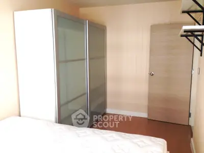 Modern bedroom with sleek wardrobe and minimalist design