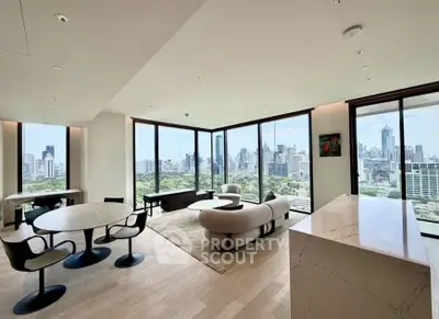 Luxurious high-rise living room with panoramic city views and modern furnishings.