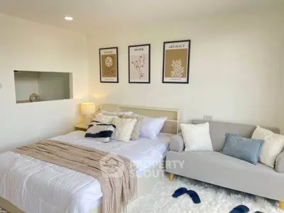 Cozy bedroom with stylish decor and plush bedding