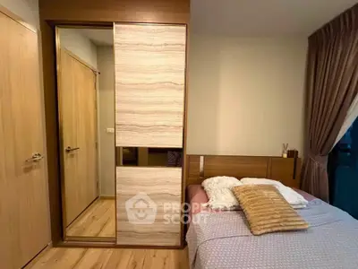 Cozy bedroom with modern wooden wardrobe and soft lighting, perfect for relaxation.