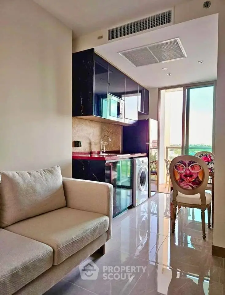 Modern apartment interior with compact kitchen and cozy living area