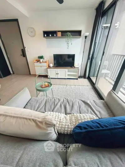Modern living room with cozy sofa and balcony view