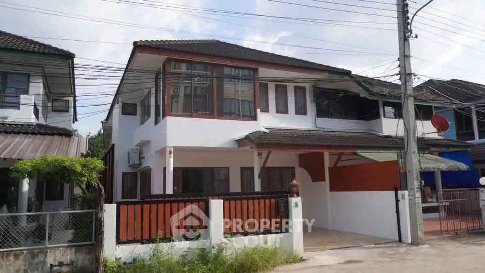 Charming two-story house with modern design and spacious driveway in a serene neighborhood.