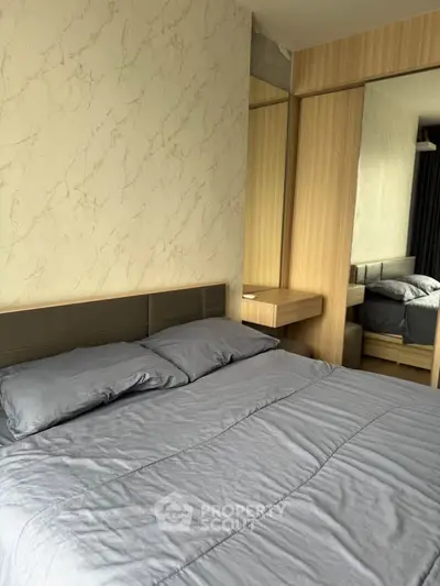 Modern bedroom with stylish decor and cozy bedding