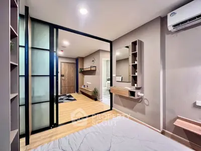 Modern bedroom with sliding glass doors and stylish decor