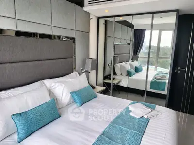 Luxurious modern bedroom with mirrored wardrobe and stylish decor