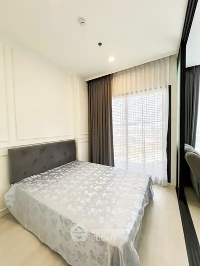 Bright and modern bedroom with large window and elegant decor