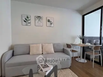Modern living room with cozy sofa and dining area, perfect for urban living.