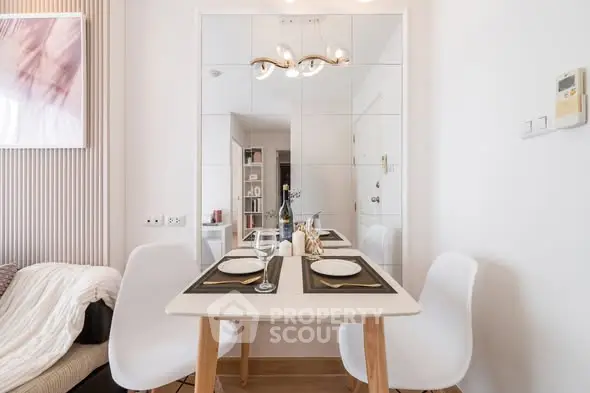 Modern dining area with stylish decor and elegant table setting in a cozy apartment.